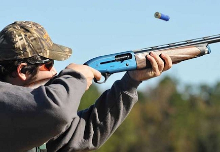 Rifle athlete aiming at a shooting range